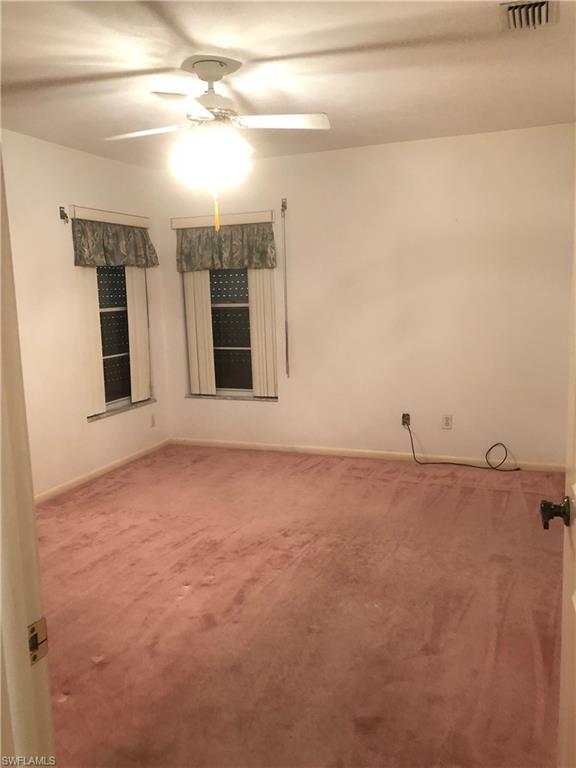 538 Roma Court Naples, FL 34110 - Photo 19 of 19 a view of an empty room with a kitchen