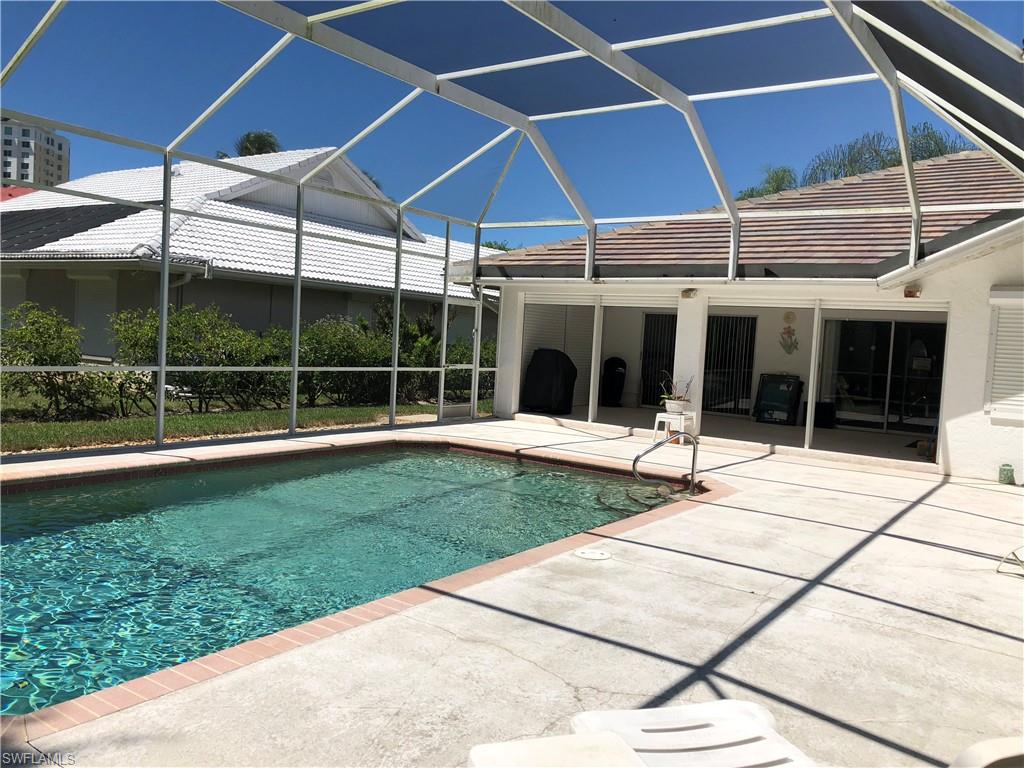 538 Roma Court Naples, FL 34110 - Photo 4 of 19 a view of a house with a garden