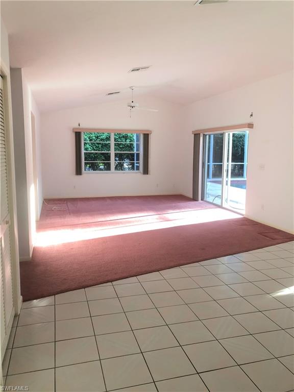 538 Roma Court Naples, FL 34110 - Photo 8 of 19 a view of an empty room with a window