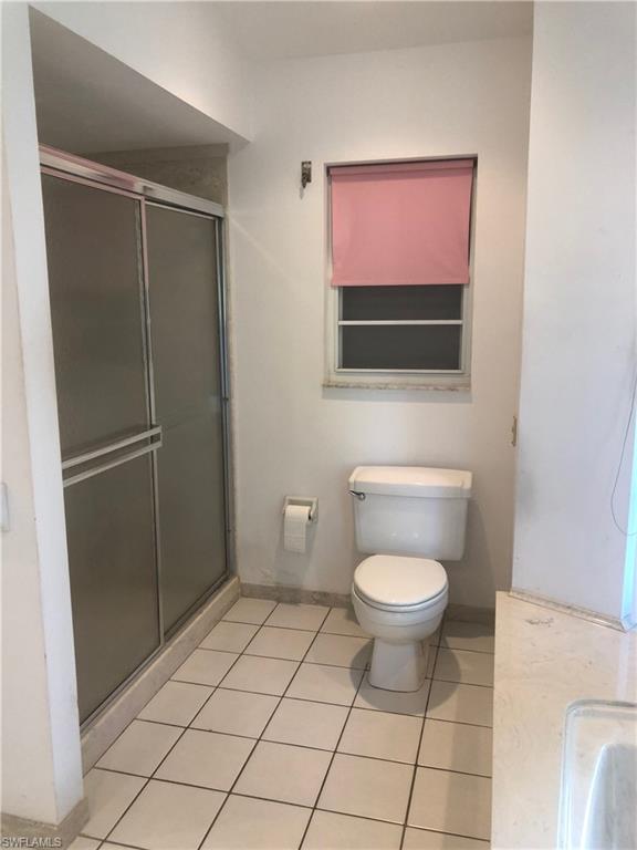 538 Roma Court Naples, FL 34110 - Photo 10 of 19 a bathroom with a toilet