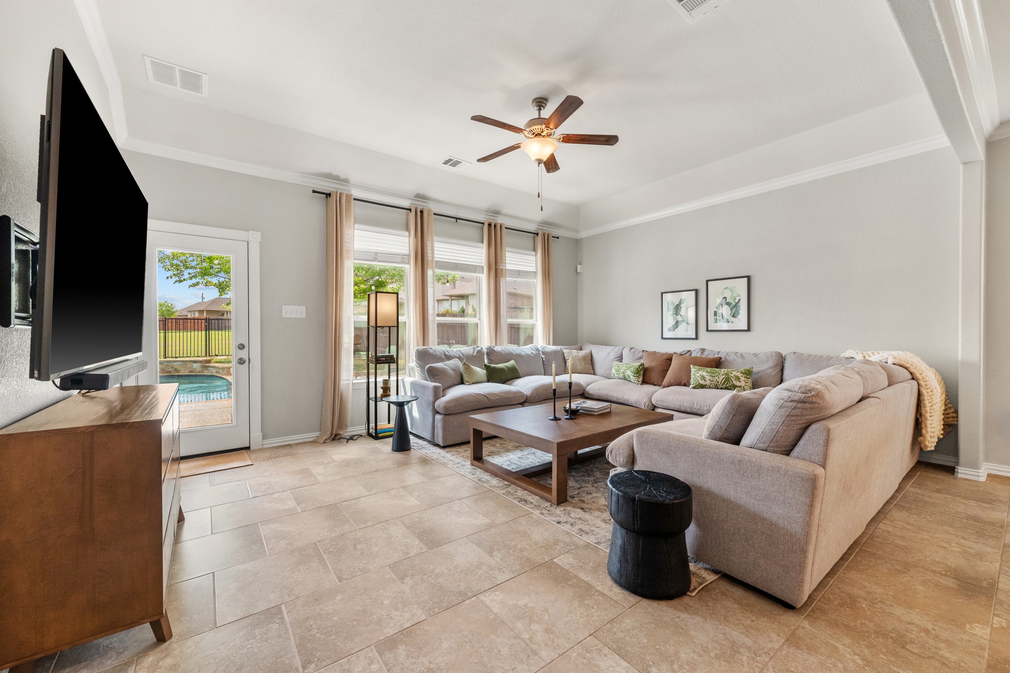 18312 Turning Stream Lane Pflugerville, TX 78660 - Photo 13 of 40 a living room with furniture and a flat screen tv