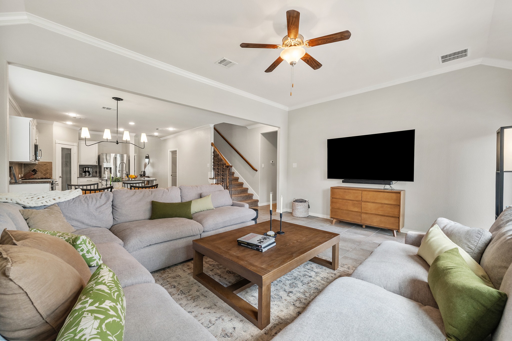 18312 Turning Stream Lane Pflugerville, TX 78660 - Photo 15 of 40 a living room with furniture and a flat screen tv