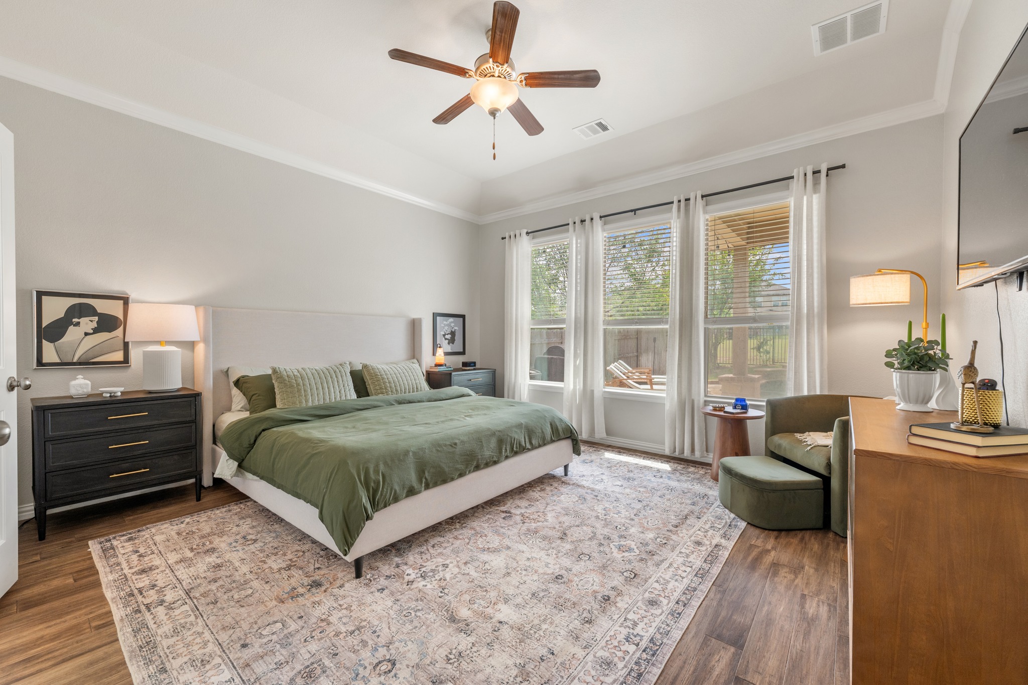 18312 Turning Stream Lane Pflugerville, TX 78660 - Photo 17 of 40 a bedroom with a bed a large window and couch