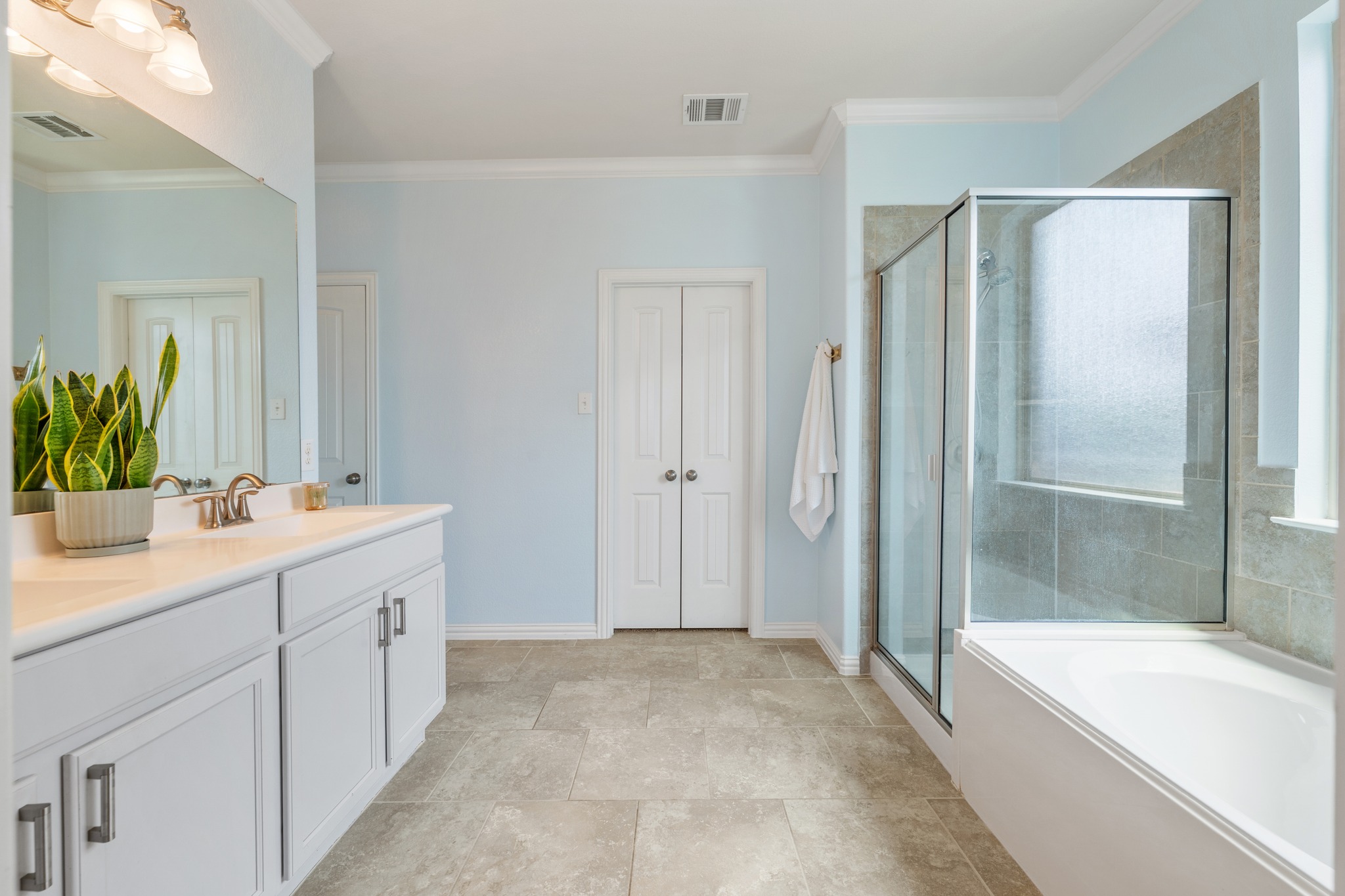 18312 Turning Stream Lane Pflugerville, TX 78660 - Photo 19 of 40 a bathroom with a tub sink and mirror