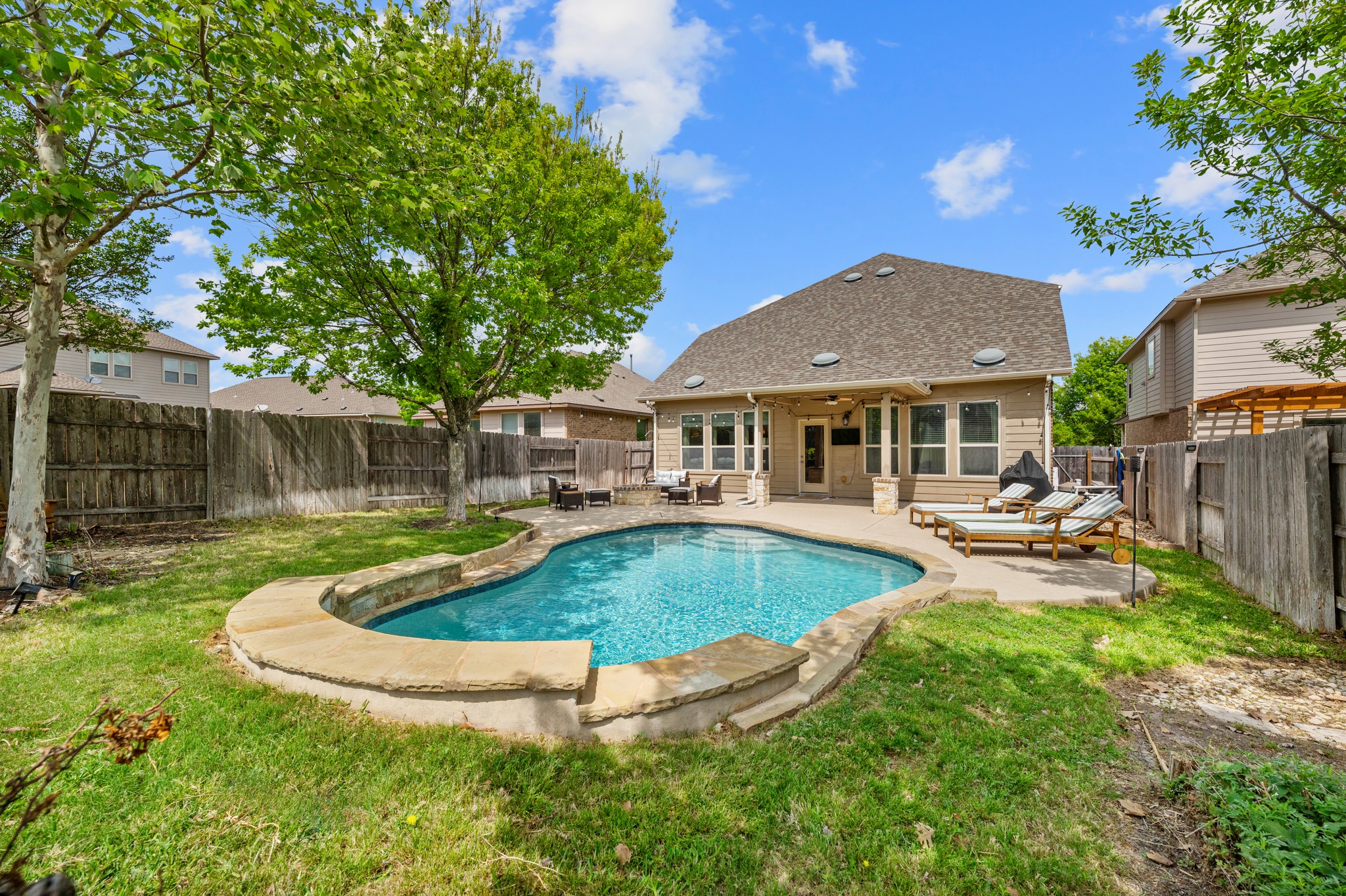 18312 Turning Stream Lane Pflugerville, TX 78660 - Photo 2 of 40 a view of a house with swimming pool and sitting area