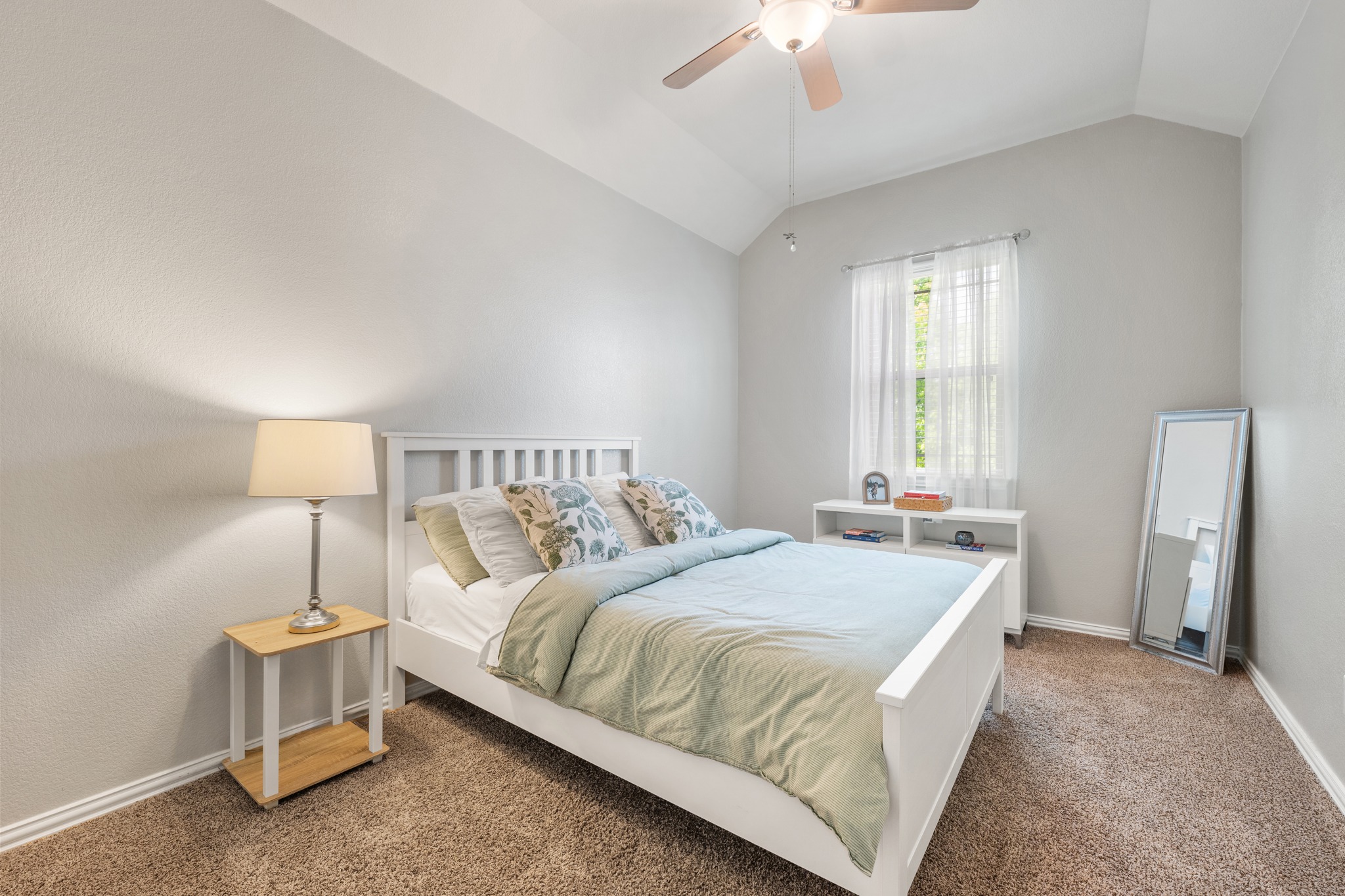 18312 Turning Stream Lane Pflugerville, TX 78660 - Photo 22 of 40 a bedroom with a bed and a lamp