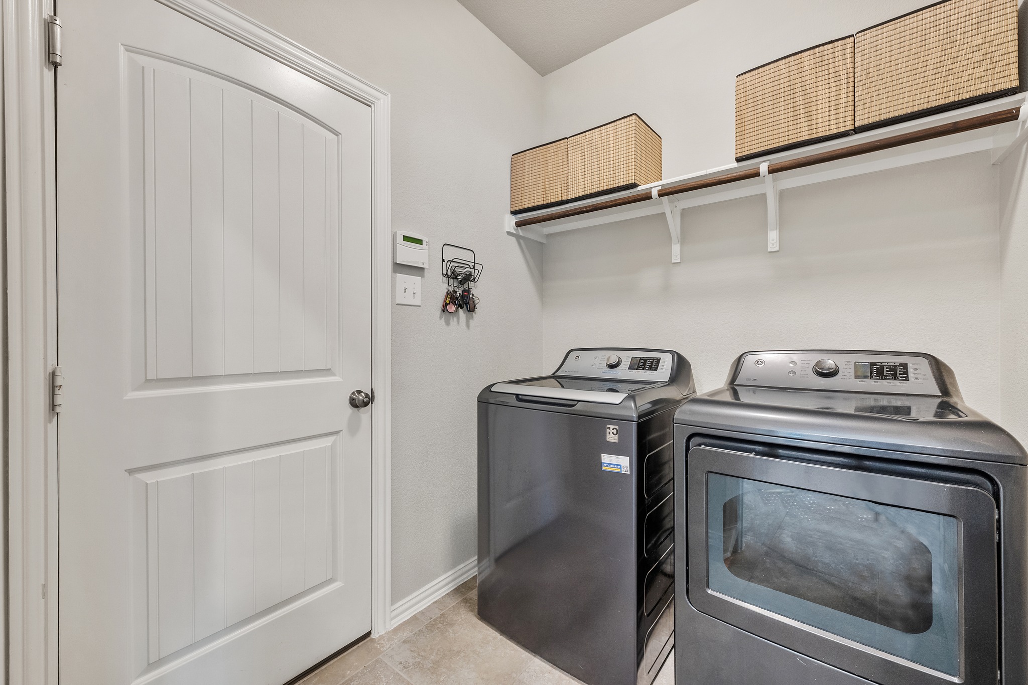 18312 Turning Stream Lane Pflugerville, TX 78660 - Photo 26 of 40 a utility room with dryer and washer