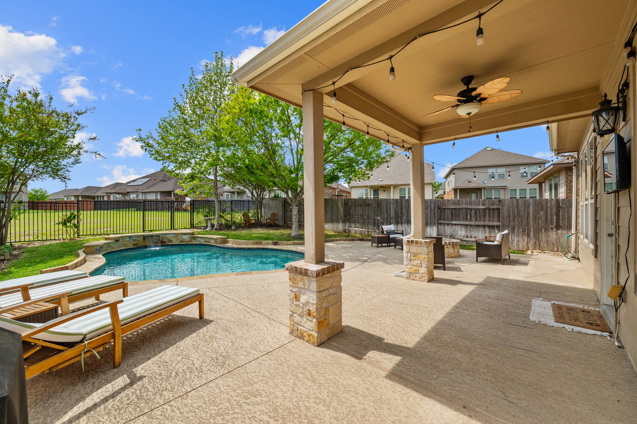 18312 Turning Stream Lane Pflugerville, TX 78660 - Photo 28 of 40 a view of a patio with a table and chairs
