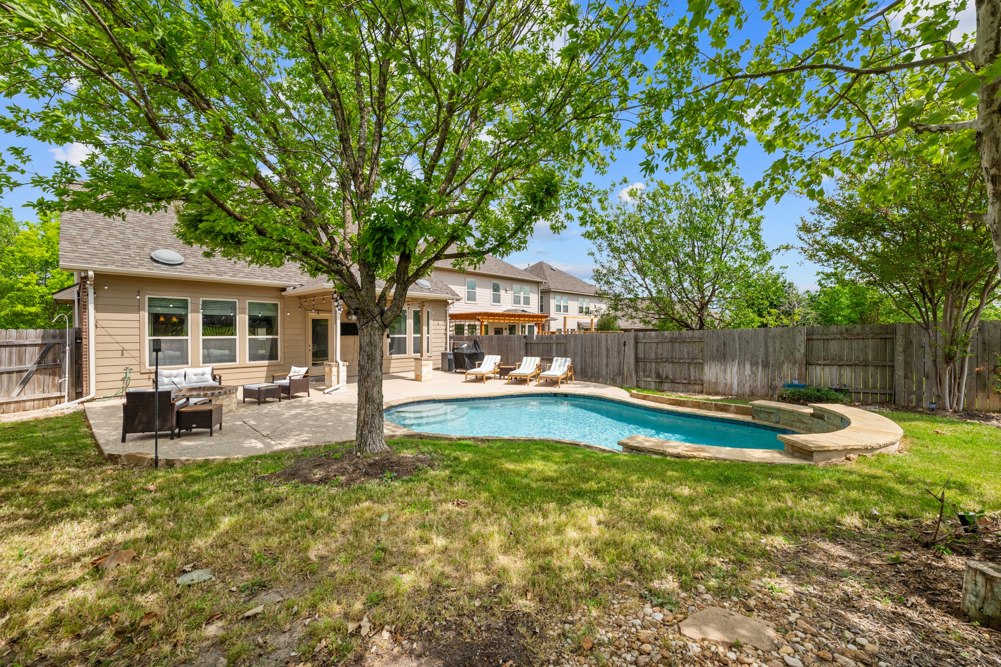 18312 Turning Stream Lane Pflugerville, TX 78660 - Photo 30 of 40 a view of a house with swimming pool and sitting area
