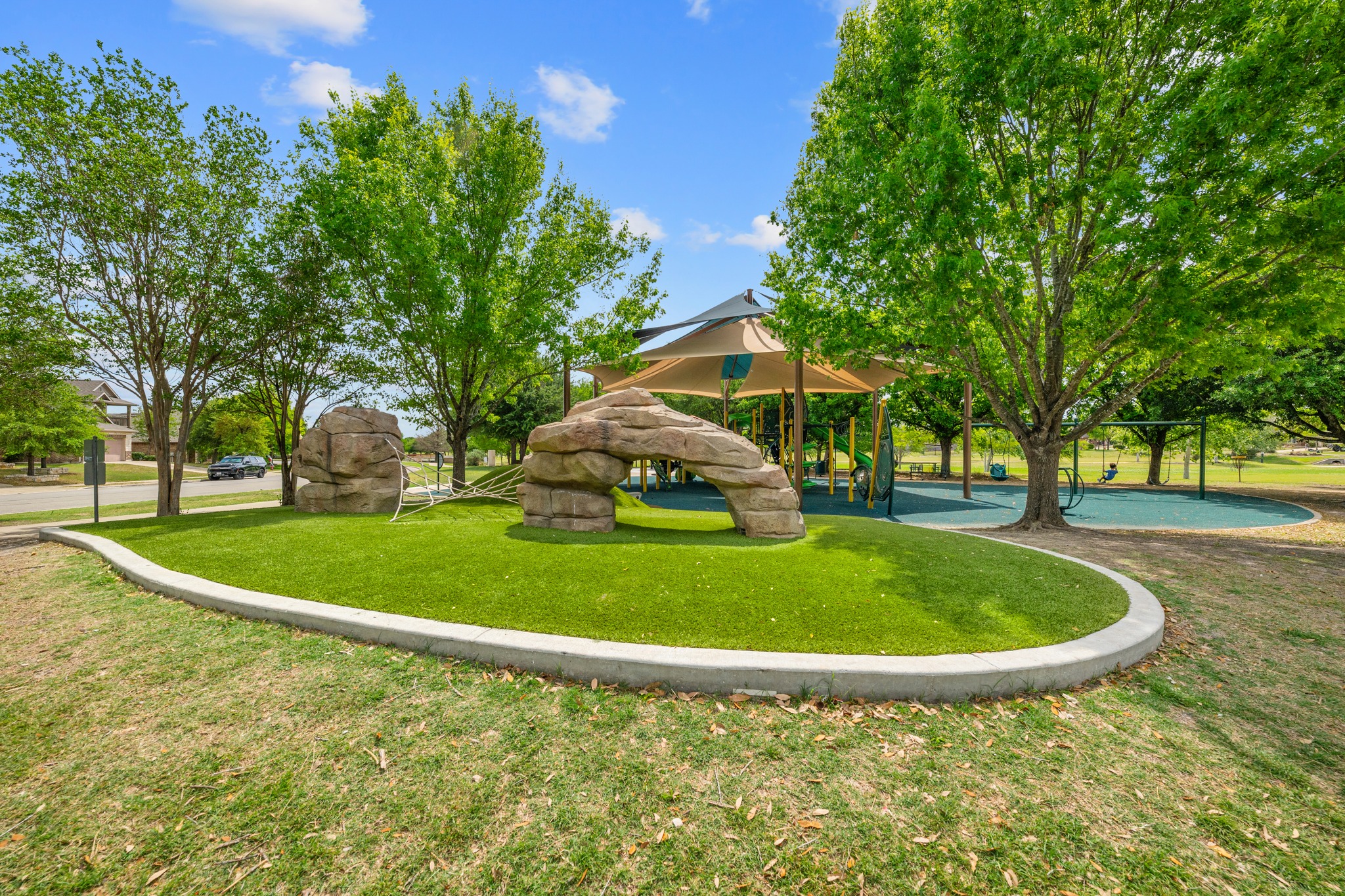 18312 Turning Stream Lane Pflugerville, TX 78660 - Photo 33 of 40 a view of a swimming pool with a garden and trees