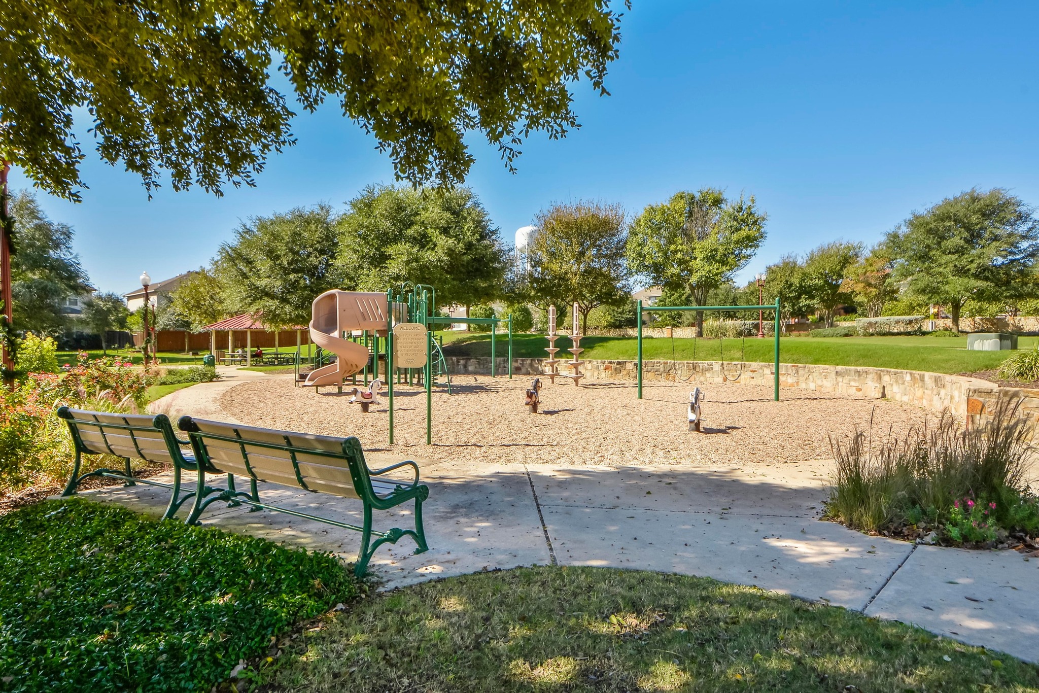 18312 Turning Stream Lane Pflugerville, TX 78660 - Photo 38 of 40 a view of a park with swings and a table