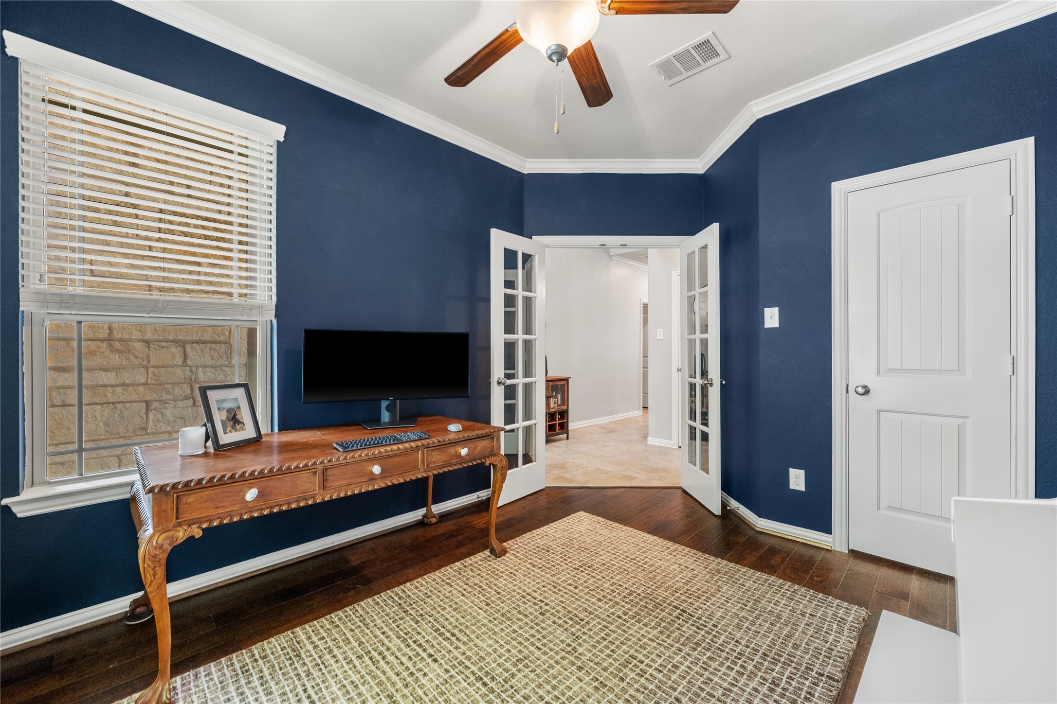 18312 Turning Stream Lane Pflugerville, TX 78660 - Photo 7 of 40 a bedroom with furniture and flat screen tv