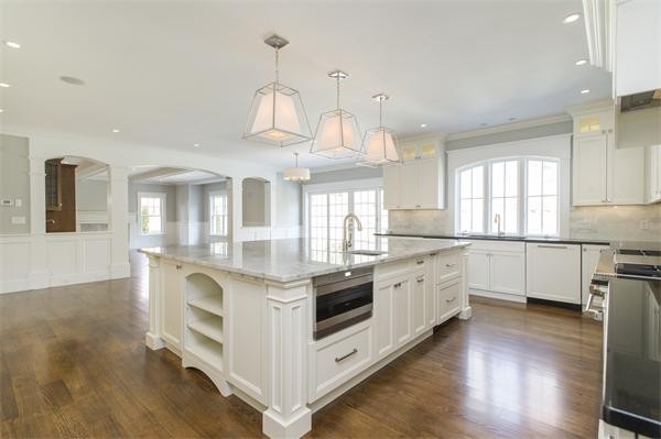 150 Princeton Road Brookline, MA 02467 - Photo 11 of 30 a kitchen with stainless steel appliances granite countertop a stove and cabinets