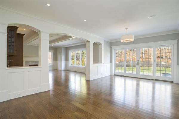 150 Princeton Road Brookline, MA 02467 - Photo 12 of 30 a view of an empty room with wooden floor and a window