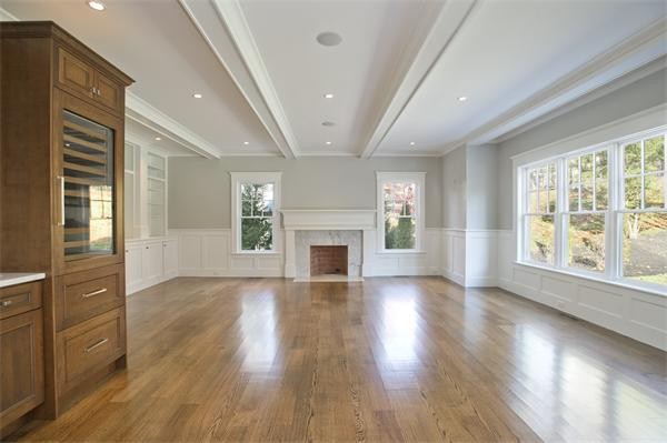150 Princeton Road Brookline, MA 02467 - Photo 13 of 30 an empty room with wooden floor fireplace and windows