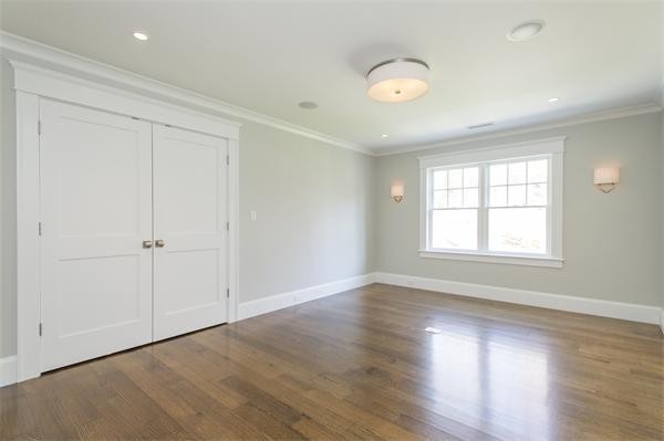 150 Princeton Road Brookline, MA 02467 - Photo 21 of 30 an empty room with wooden floor and windows