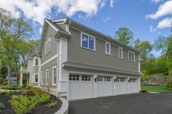 150 Princeton Road Brookline, MA 02467 - Photo 25 of 30 a front view of a house with a garden