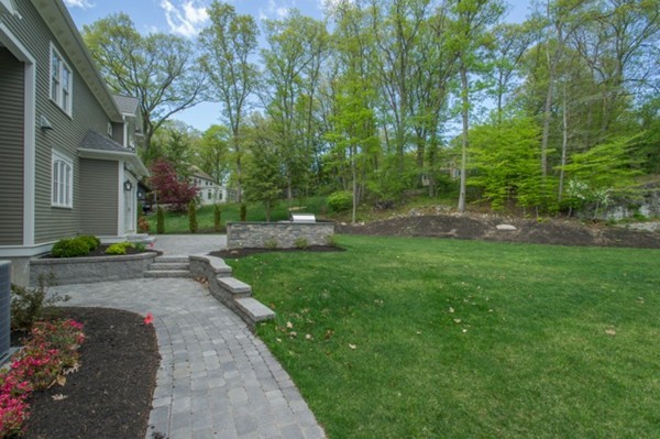 150 Princeton Road Brookline, MA 02467 - Photo 28 of 30 a view of a garden with a fountain