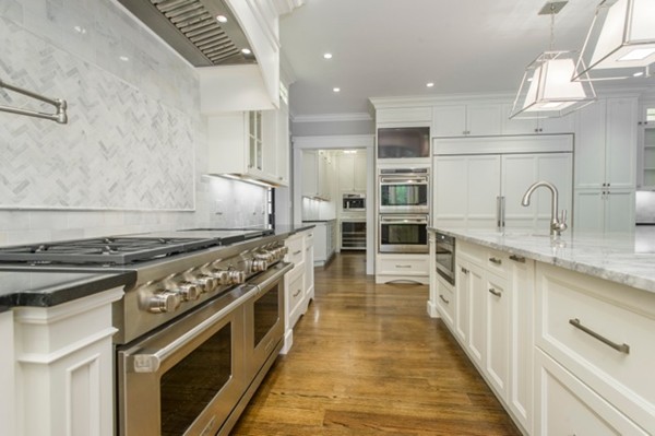 150 Princeton Road Brookline, MA 02467 - Photo 30 of 30 a large kitchen with stainless steel appliances granite countertop a stove oven and a sink