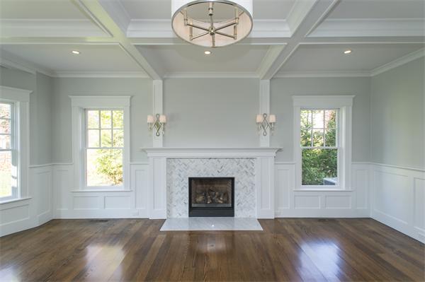 150 Princeton Road Brookline, MA 02467 - Photo 5 of 30 an empty room with wooden floor fireplace and windows
