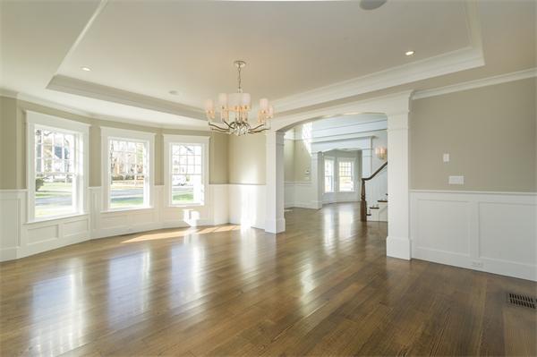 150 Princeton Road Brookline, MA 02467 - Photo 7 of 30 a view of an empty room with wooden floor and a window