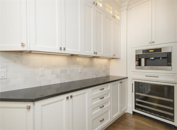 150 Princeton Road Brookline, MA 02467 - Photo 8 of 30 a kitchen with granite countertop white cabinets and sink