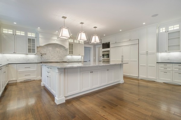 150 Princeton Road Brookline, MA 02467 - Photo 9 of 30 a large kitchen with kitchen island white cabinets and stainless steel appliances