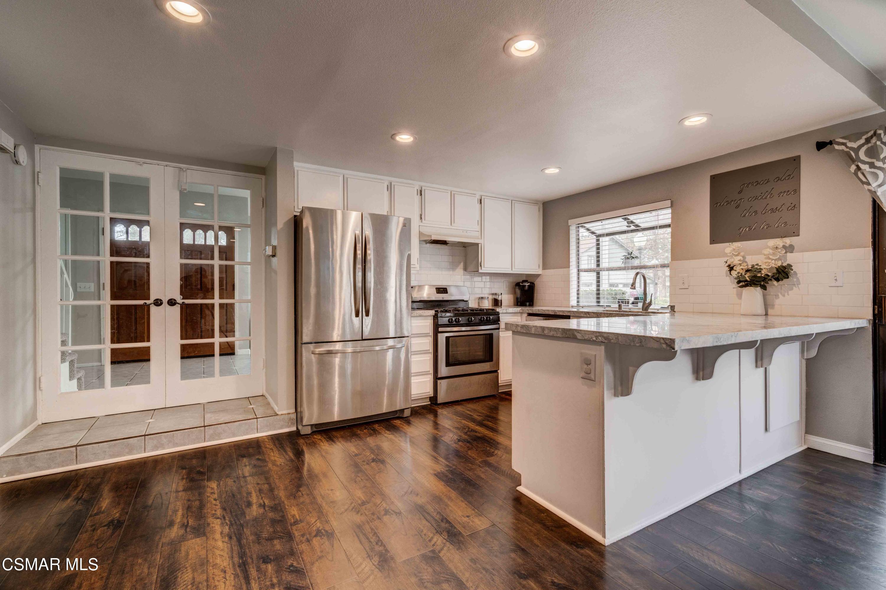 3620 Olds Road Oxnard, CA 93033 - Photo 2 of 34 a kitchen with a refrigerator and a stove top oven