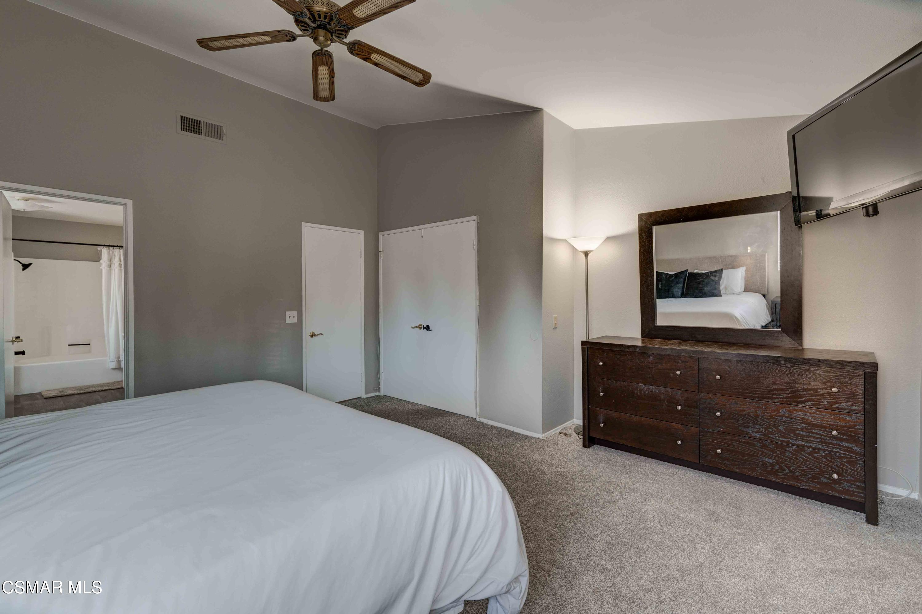 3620 Olds Road Oxnard, CA 93033 - Photo 15 of 34 a bedroom with a bed and a mirror on dresser