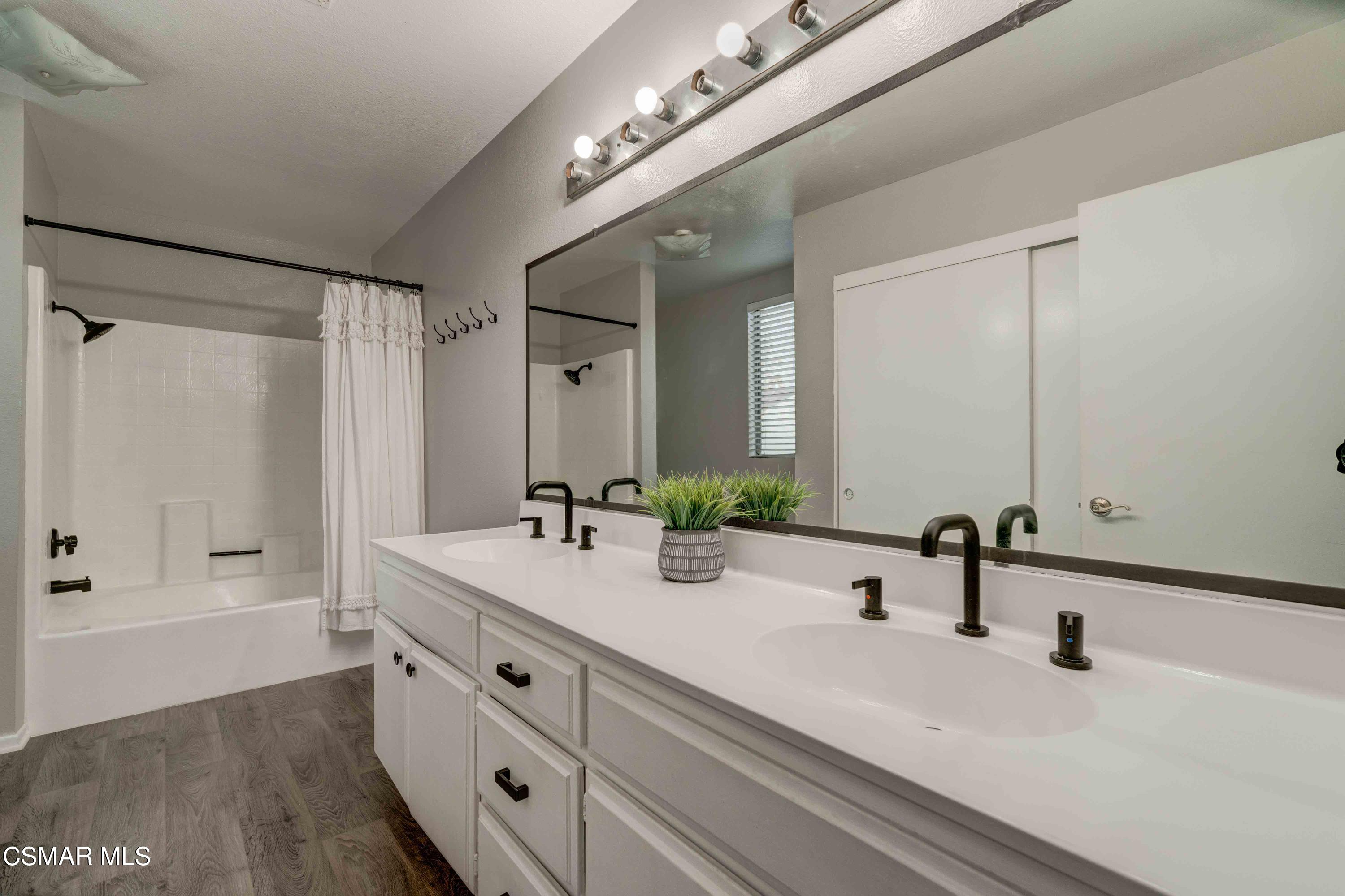 3620 Olds Road Oxnard, CA 93033 - Photo 17 of 34 a bathroom with double vanity sinks and a mirror