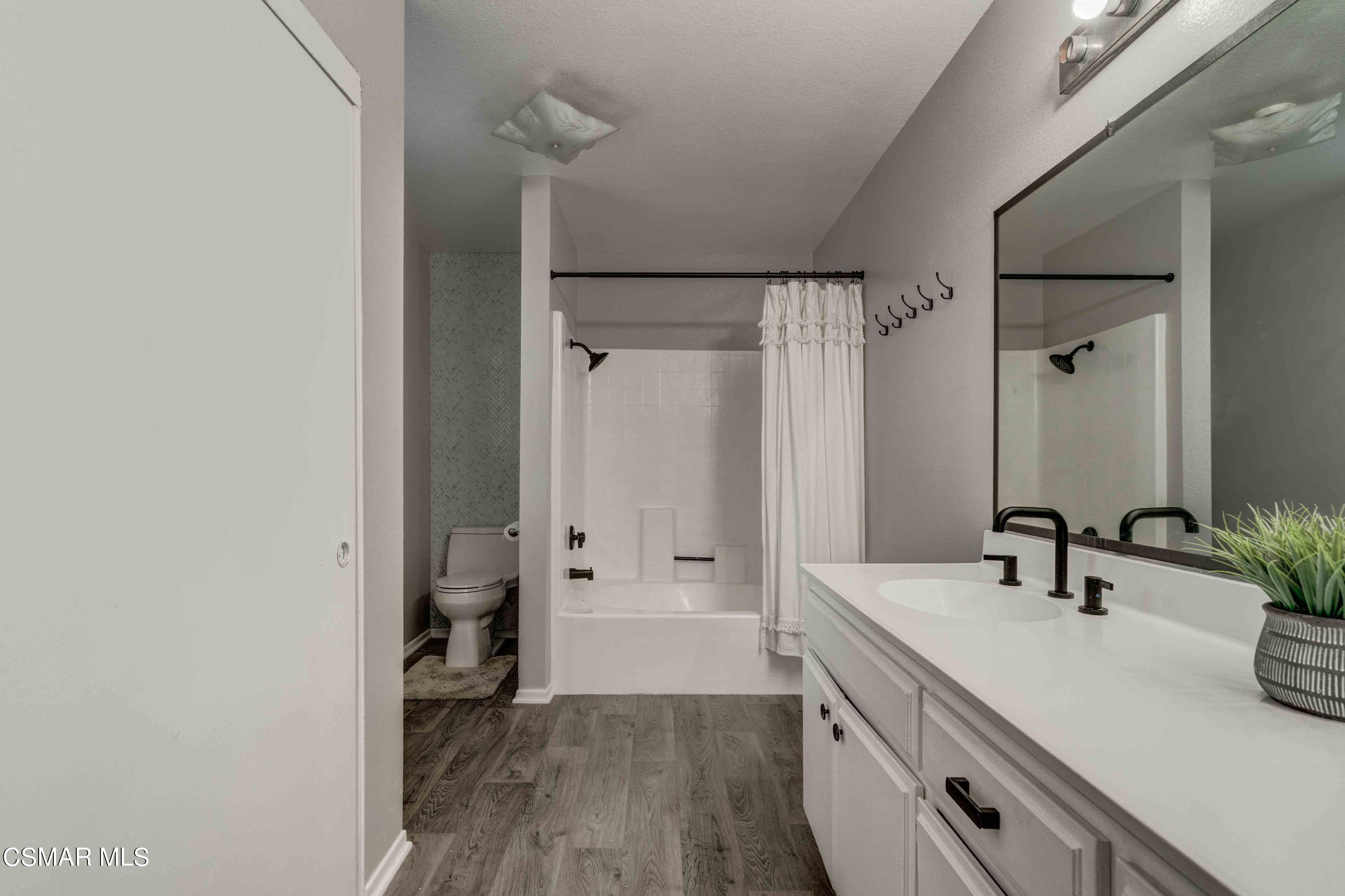 3620 Olds Road Oxnard, CA 93033 - Photo 18 of 34 a bathroom with a double vanity sink a mirror and a shower
