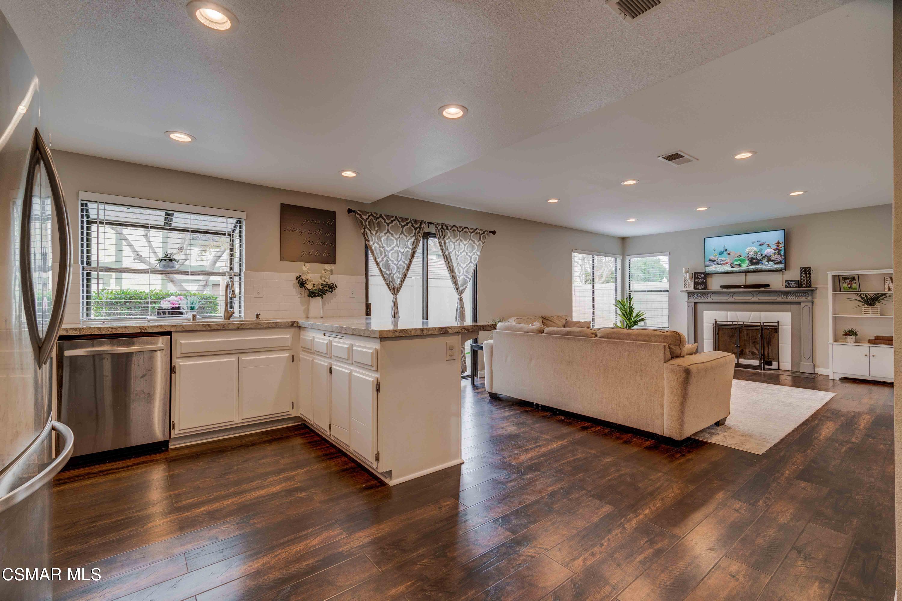 3620 Olds Road Oxnard, CA 93033 - Photo 4 of 34 a kitchen with stainless steel appliances granite countertop a white cabinets a sink a stove a dining table and chairs