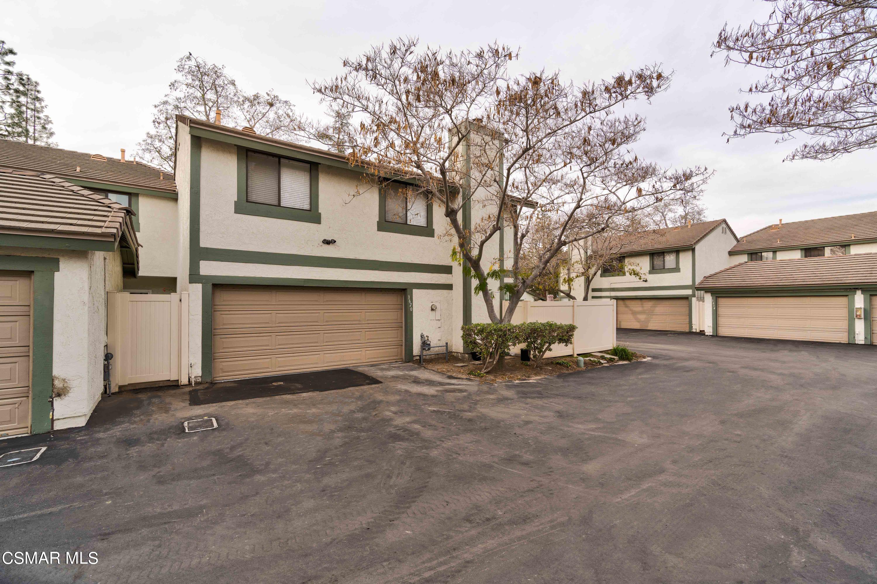 3620 Olds Road Oxnard, CA 93033 - Photo 31 of 34 a view of a house with a yard and garage