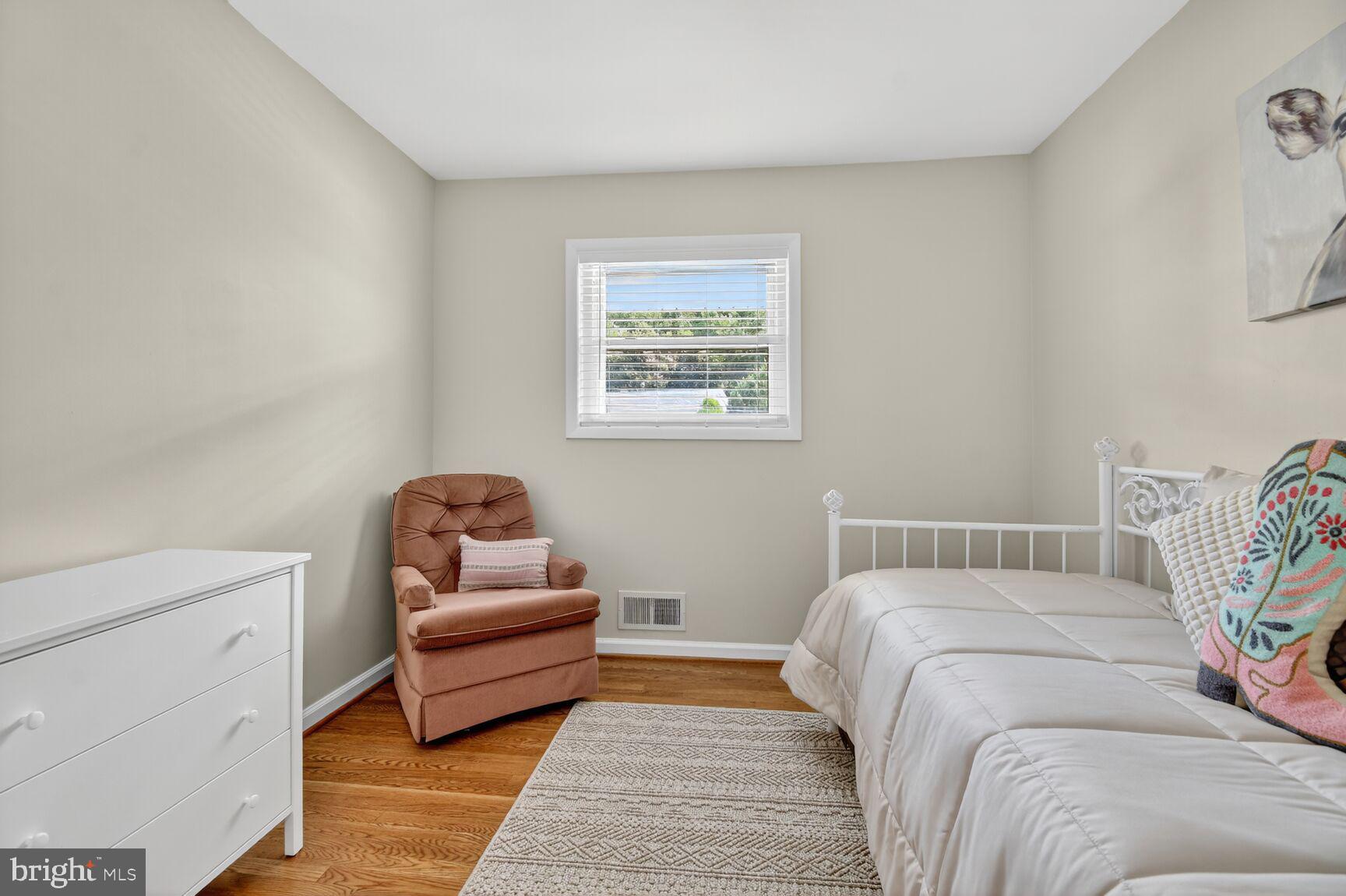 6801 Trowbridge Place Fort Washington, MD 20744 - Photo 13 of 30 a bedroom with a bed and a couch