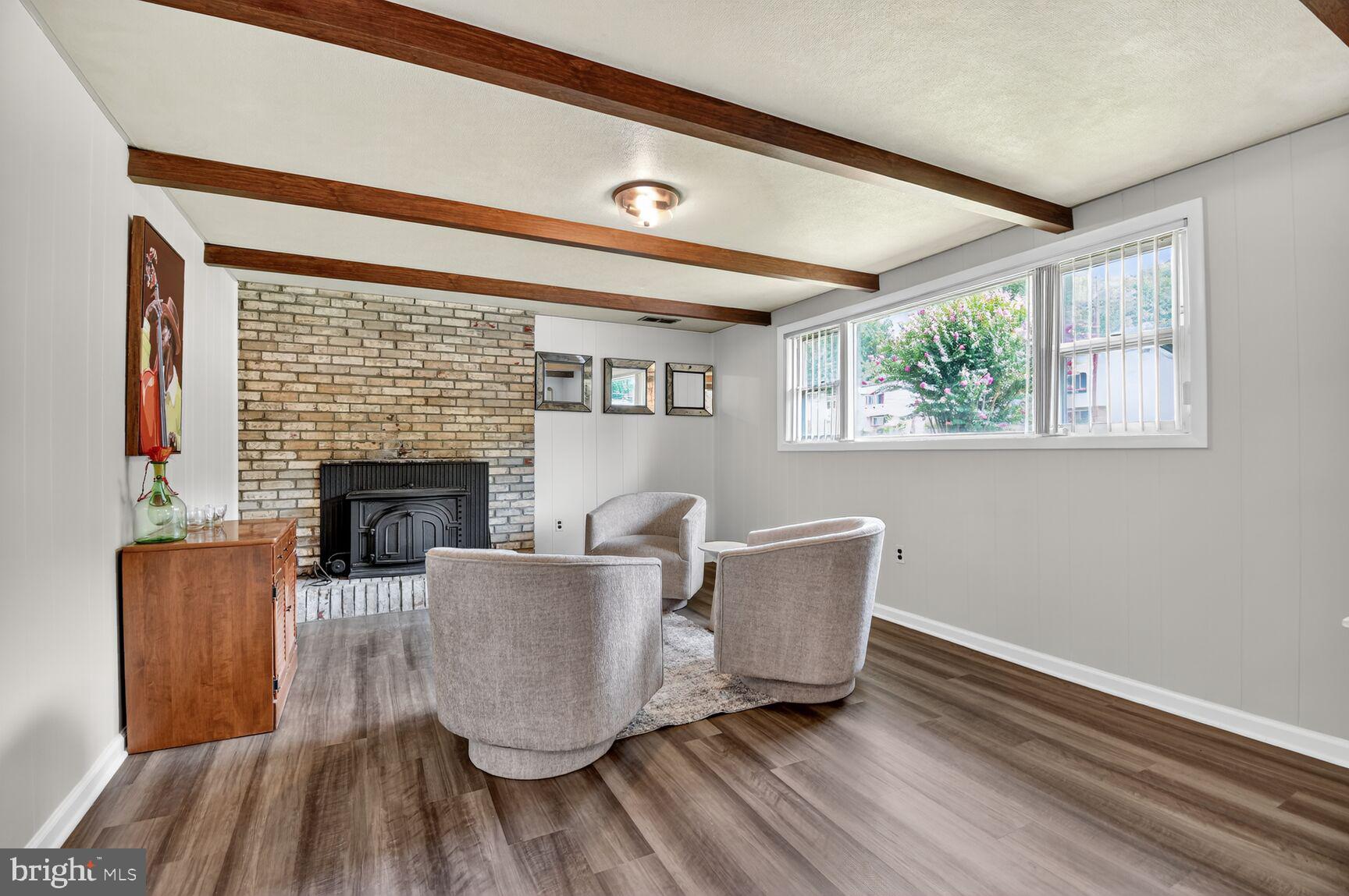 6801 Trowbridge Place Fort Washington, MD 20744 - Photo 20 of 30 a living room with furniture and a fireplace