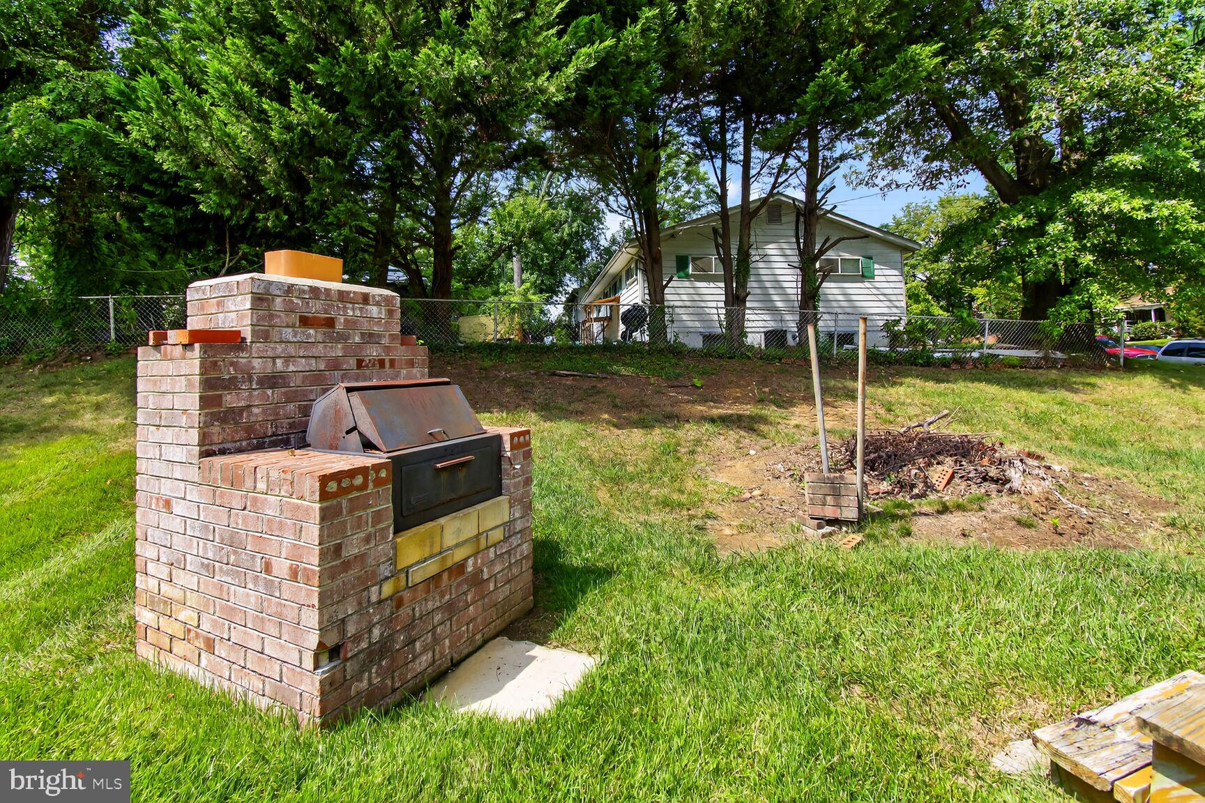 6801 Trowbridge Place Fort Washington, MD 20744 - Photo 26 of 30 a view of a garden with a bench