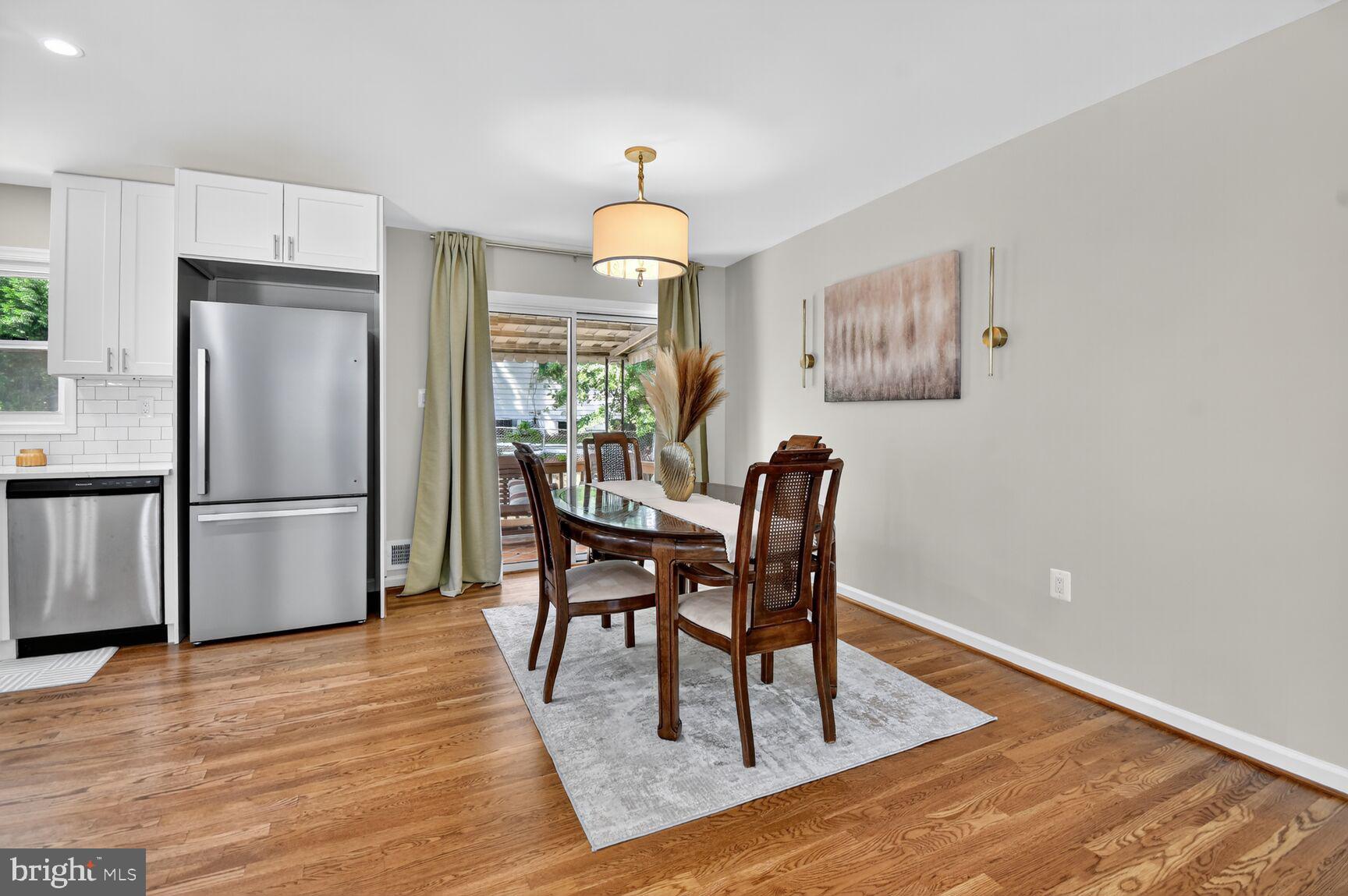 6801 Trowbridge Place Fort Washington, MD 20744 - Photo 6 of 30 a view of a dining room with furniture window and wooden floor