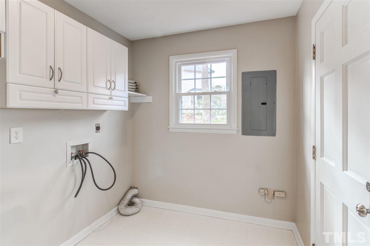 5705 Calorie Court Raleigh, NC 27612 - Photo 19 of 24 a bathroom with a bathtub and a window