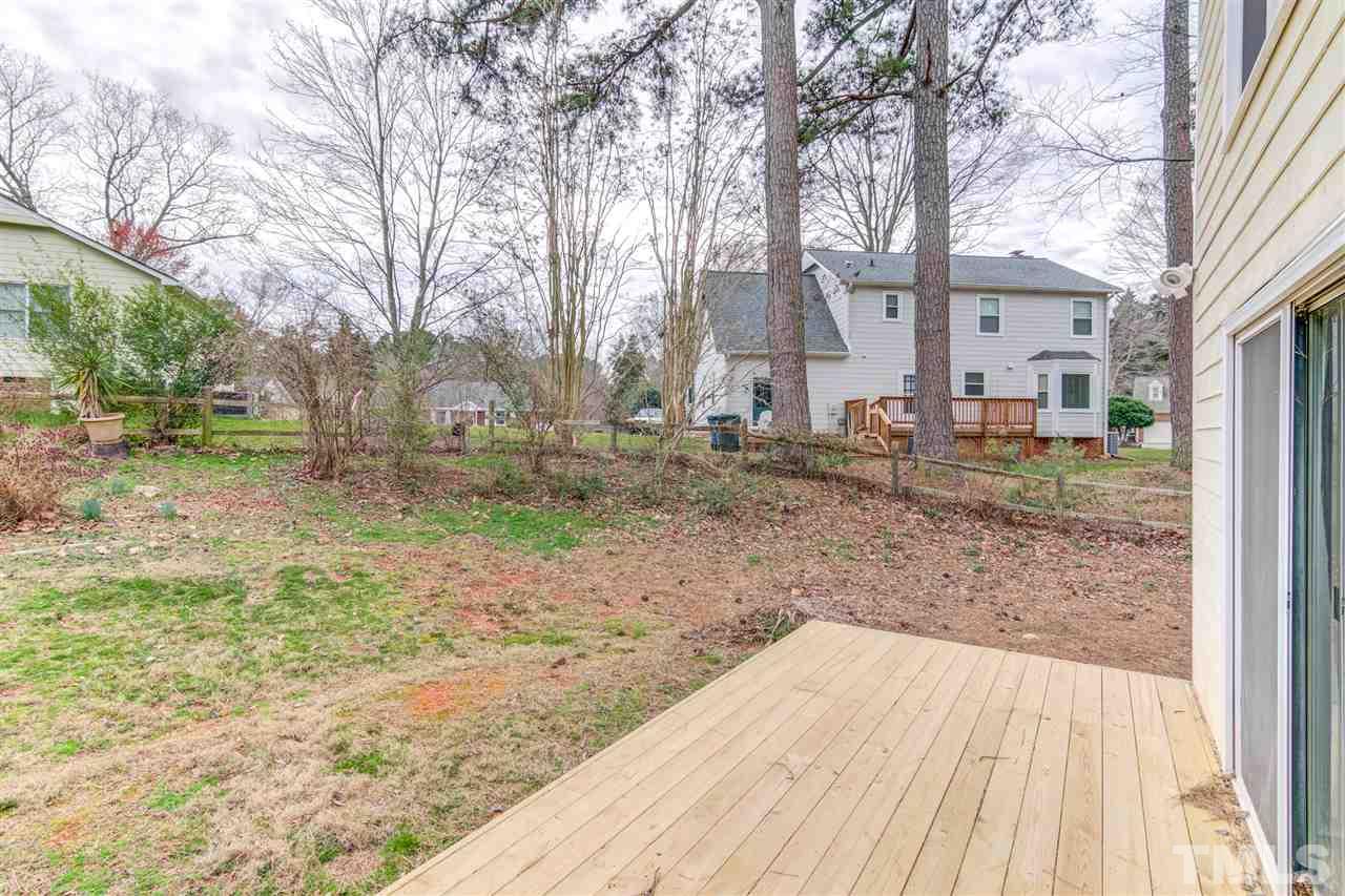 5705 Calorie Court Raleigh, NC 27612 - Photo 21 of 24 a backyard of a house with lots of green space