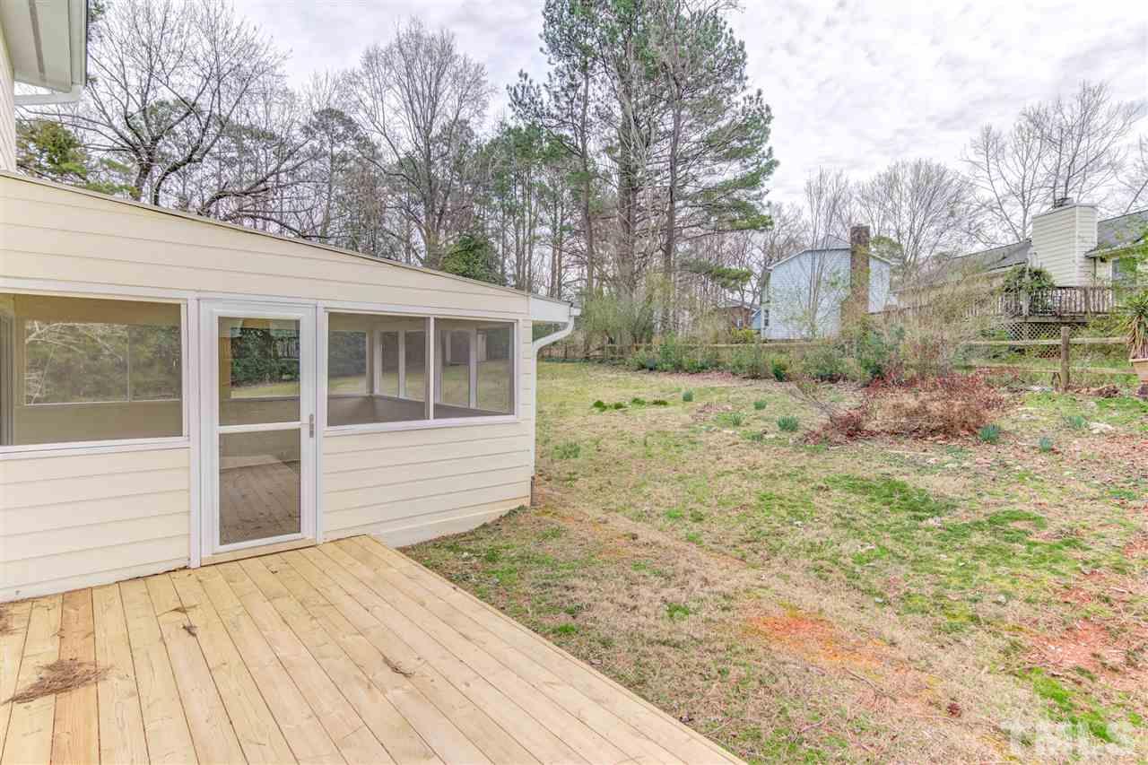 5705 Calorie Court Raleigh, NC 27612 - Photo 22 of 24 a front view of a house with a yard