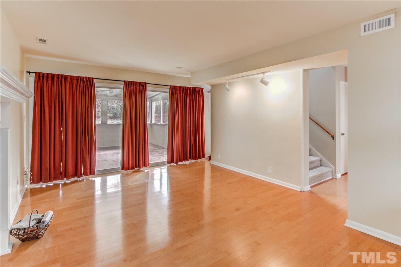 5705 Calorie Court Raleigh, NC 27612 - Photo 7 of 24 wooden floor in an empty room with a window