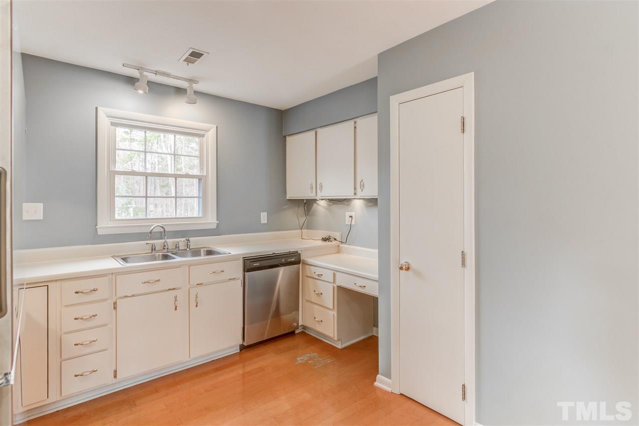 5705 Calorie Court Raleigh, NC 27612 - Photo 9 of 24 a view of cabinets a sink and dishwasher in a room