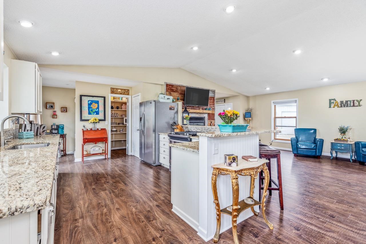 10388 Telegraph Road Winnebago, IL 61088 - Photo 11 of 48 a living room with furniture and a wooden floor