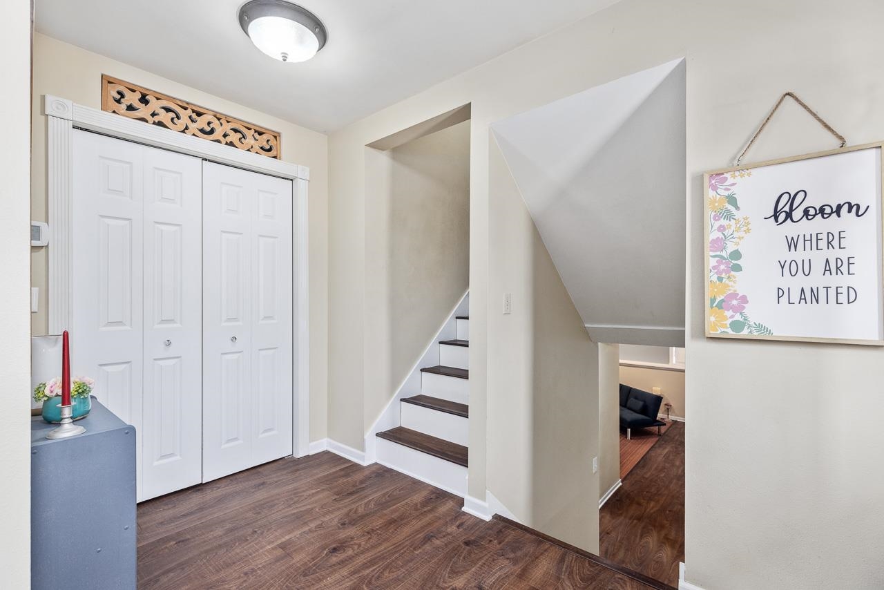 10388 Telegraph Road Winnebago, IL 61088 - Photo 15 of 48 a view of a hallway with entryway wooden floor and stairs