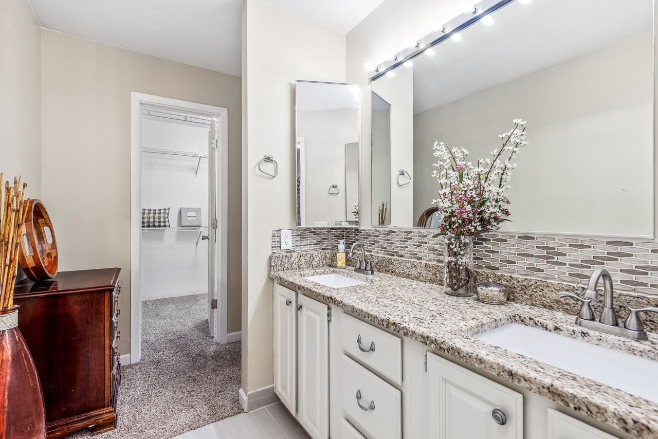 10388 Telegraph Road Winnebago, IL 61088 - Photo 19 of 48 a bathroom with a granite countertop sink and a mirror