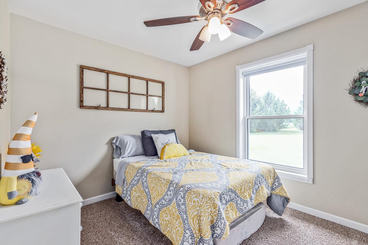10388 Telegraph Road Winnebago, IL 61088 - Photo 20 of 48 a bedroom with a bed and a window