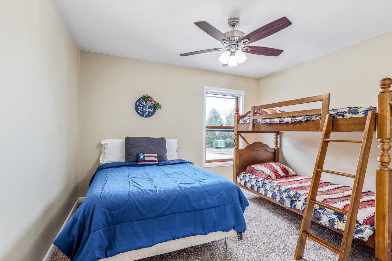 10388 Telegraph Road Winnebago, IL 61088 - Photo 22 of 48 a bedroom with a bed and window