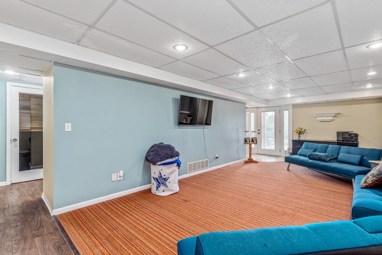 10388 Telegraph Road Winnebago, IL 61088 - Photo 25 of 48 a living room with furniture and a flat screen tv