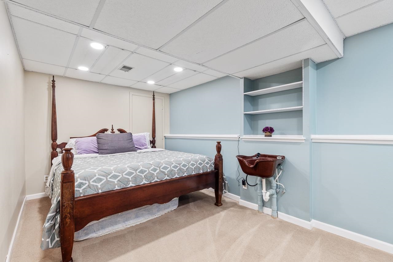 10388 Telegraph Road Winnebago, IL 61088 - Photo 27 of 48 a bedroom with a bed and a table