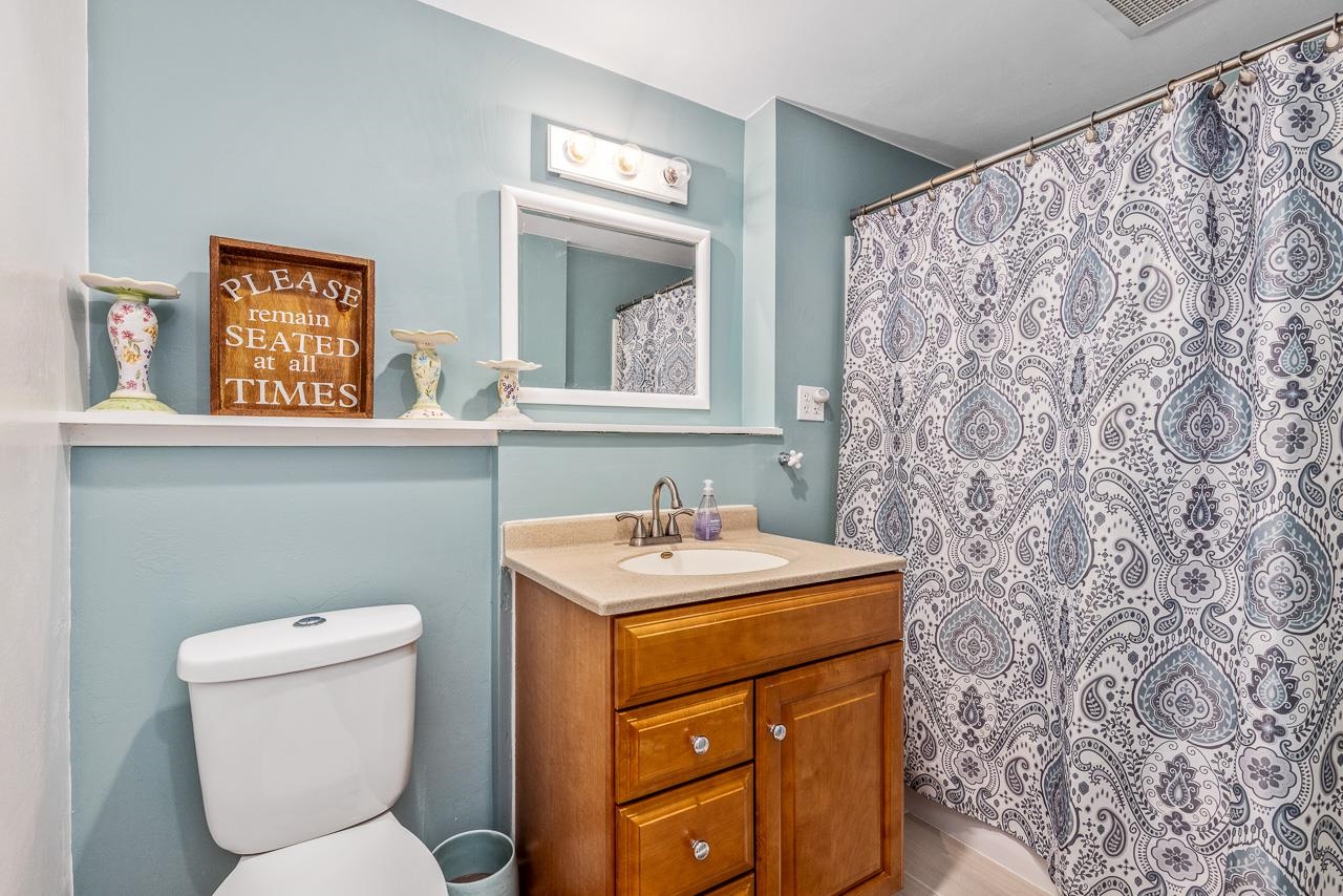 10388 Telegraph Road Winnebago, IL 61088 - Photo 29 of 48 a bathroom with a toilet sink and mirror